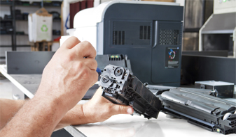 man fixing printer