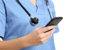 Healthcare worker holding a phone