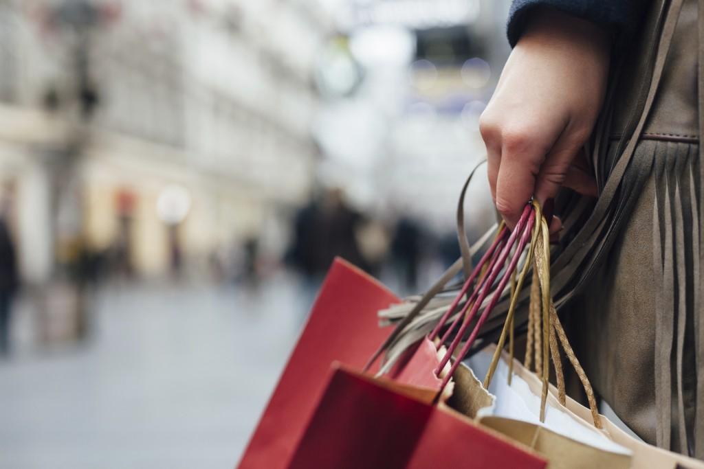 Closeup of woman holding shopping bags