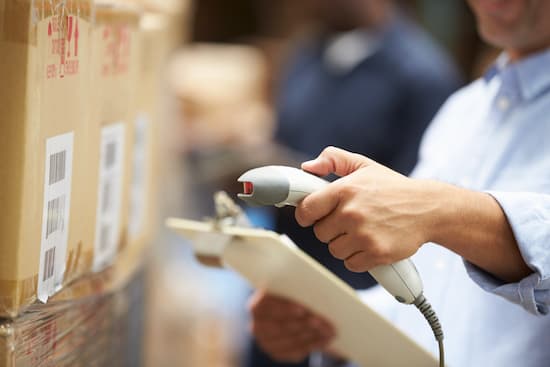 worker scanning a a package