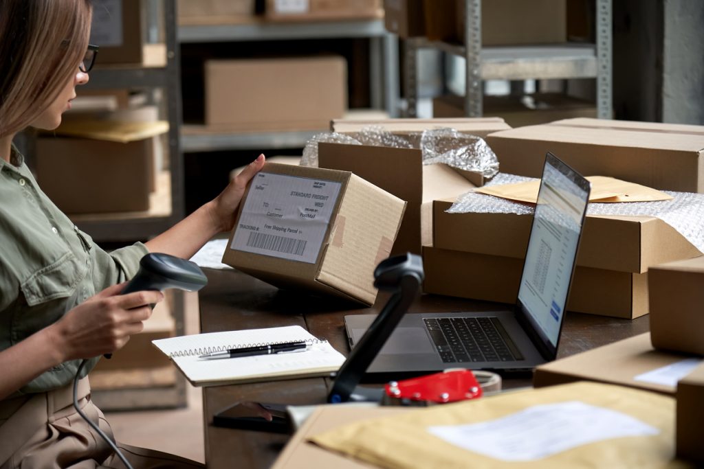 Retail warehouse worker using barcodes