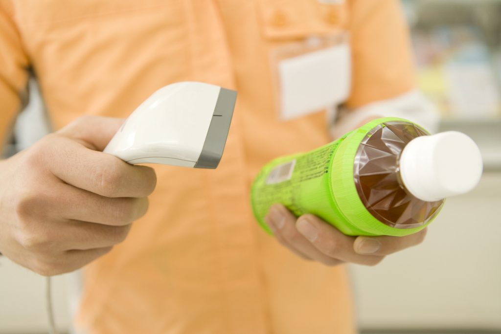 Retail worker scanning a barcode