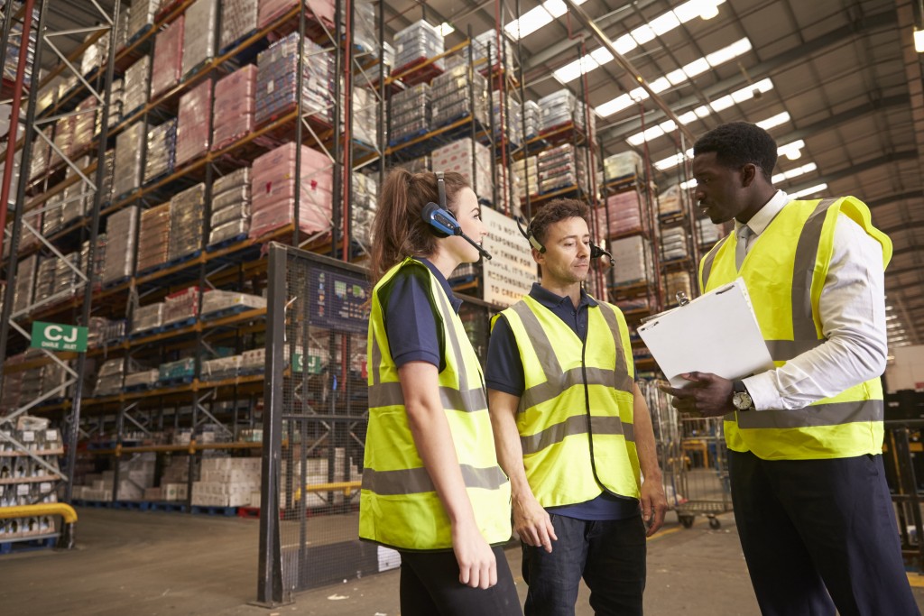 workers talking in warehouse