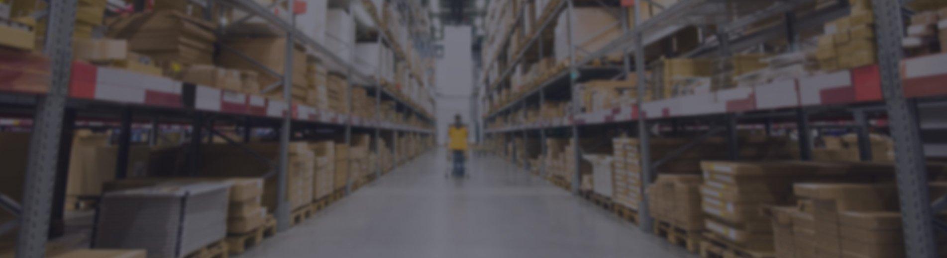 Customer in yellow coat walking through warehouse layout style shop