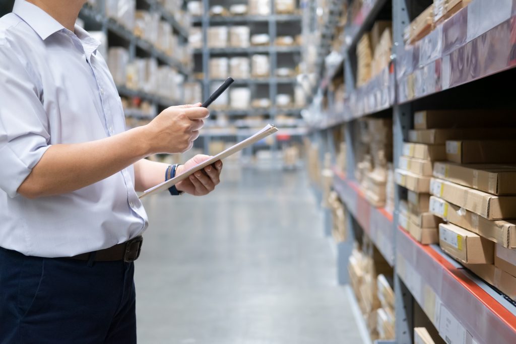 Man checking stock in warehouse