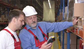 man with barcode scanner in warehouse 