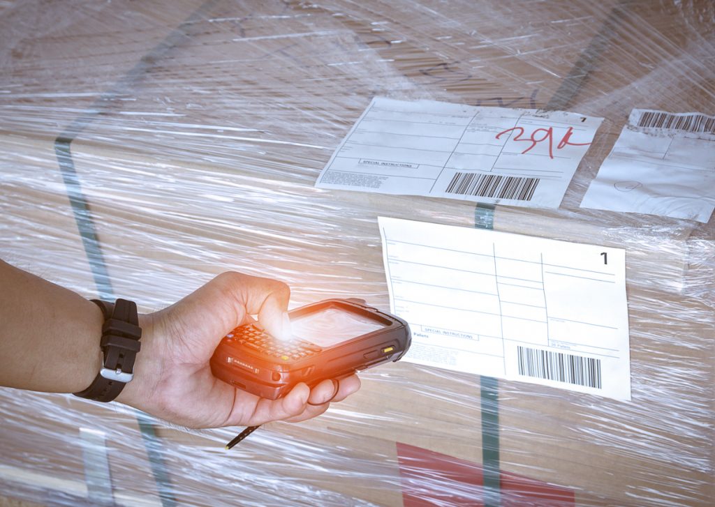 A warehouse worker scanning a barcode