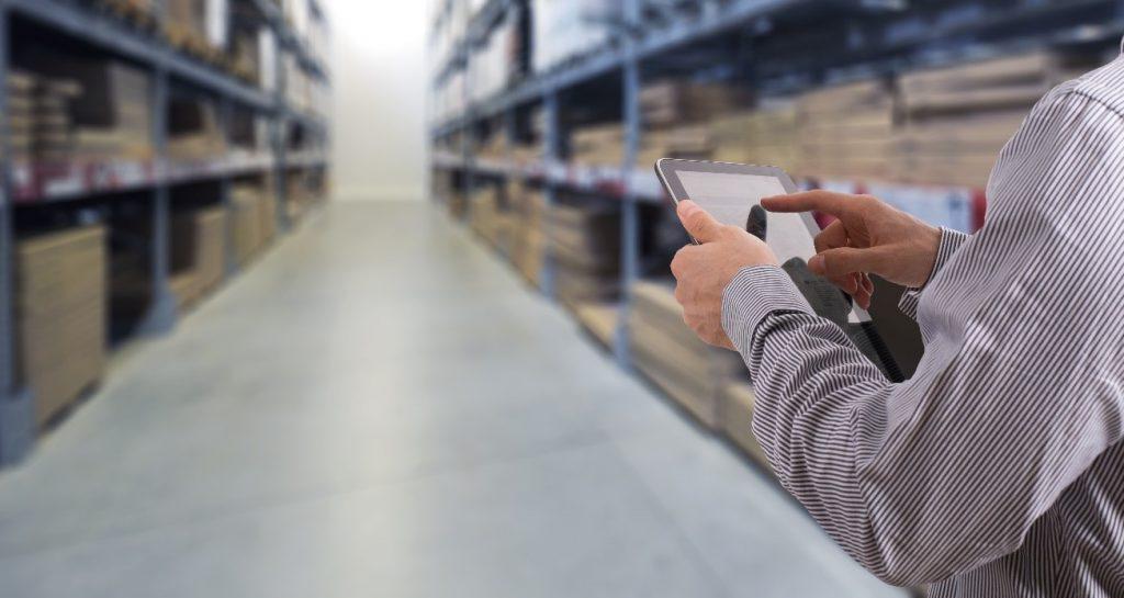 Tablet in a warehouse ready for inventory with GSM barcoding
