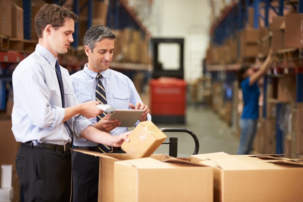 Warehouse Workers with Barcode Scanners