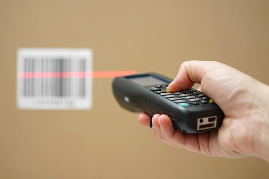 Someone scanning a barcode with a barcode scanner