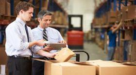 men in warehouse doing barcode stock control