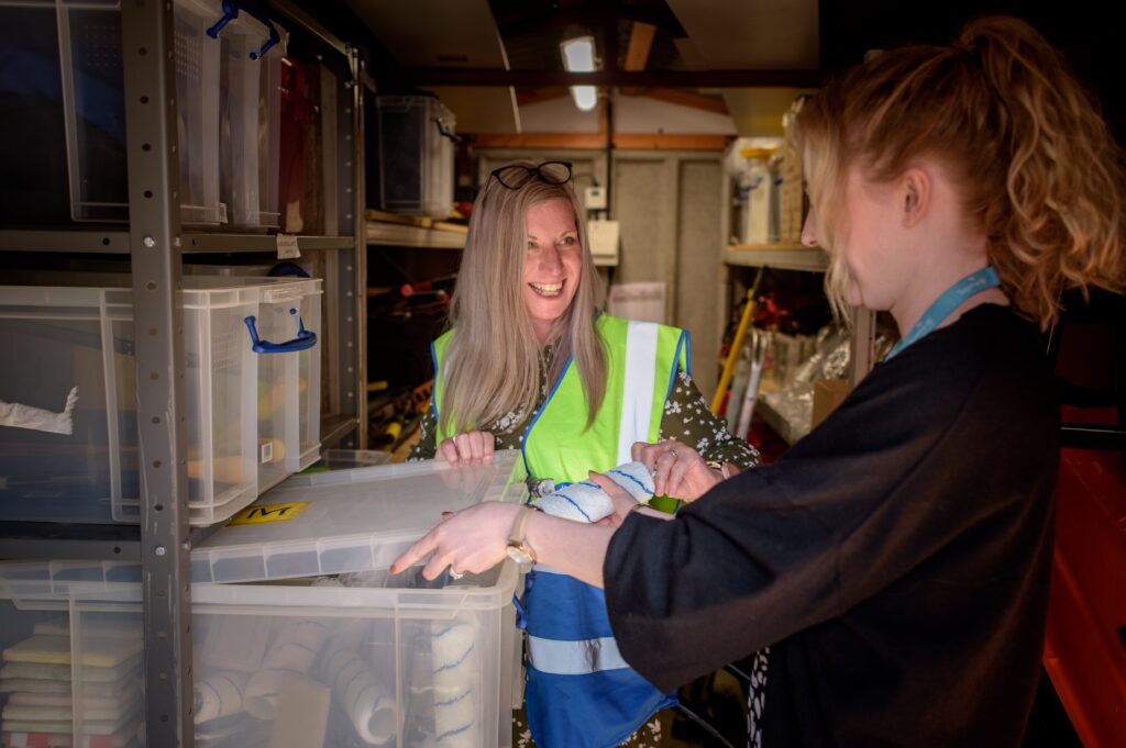 Two women using asset tracking to monitor their items