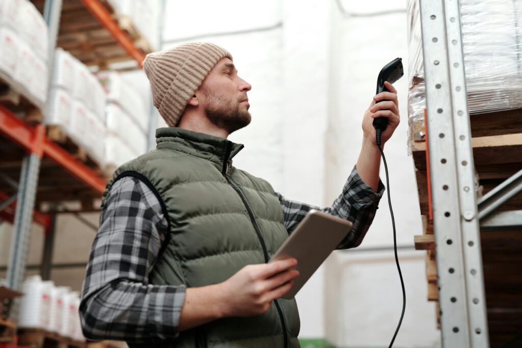 a man holding a barcode scanner